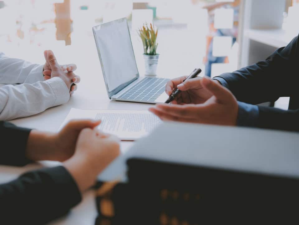 lawyer insurance broker consulting giving legal advice to couple customer